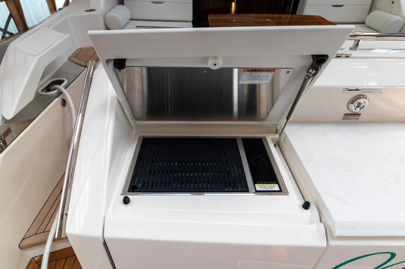 Noor Yacht Photos Pics Outdoor grill on 2023 Tiara Yachts C44 Coupe, showcasing sleek design and functionality.