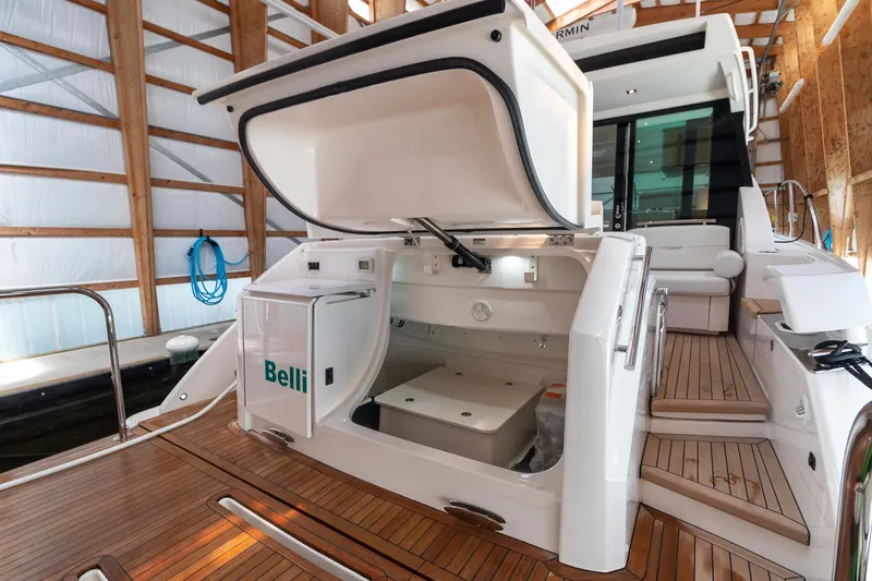 Noor Yacht Photos Pics 2023 Tiara Yachts C44 Coupe with open storage compartment on teak deck.