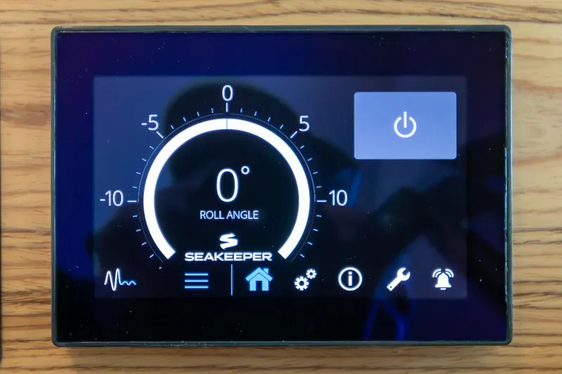 Noor Yacht Photos Pics Digital control panel of 2023 Tiara Yachts C44 Coupe displaying Seakeeper roll angle.