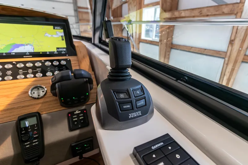Noor Yacht Photos Pics 2023 Tiara Yachts C44 Coupe helm with joystick control and navigation display.