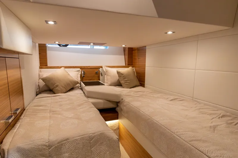 Noor Yacht Photos Pics 2023 Tiara Yachts C44 Coupe cabin with twin beds and modern lighting.