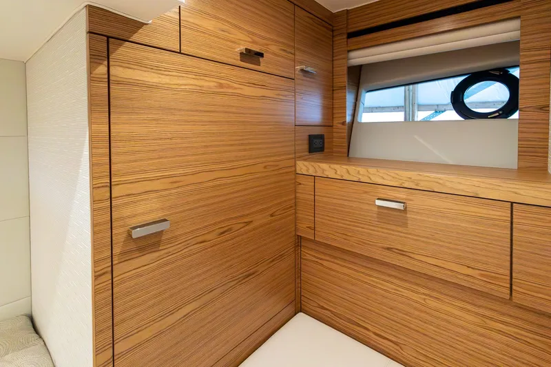 Noor Yacht Photos Pics 2023 Tiara Yachts C44 Coupe interior with sleek wooden cabinetry and modern design.