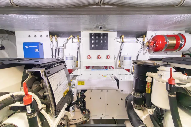 Noor Yacht Photos Pics Engine room of 2023 Tiara Yachts C44 Coupe, featuring advanced mechanical systems and safety equipment.
