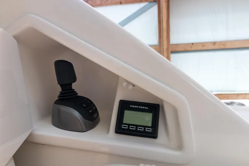 Noor Yacht Photos Pics 2023 Tiara Yachts C44 Coupe control panel with joystick and display.