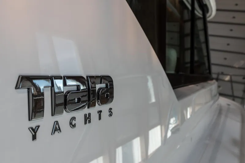 Noor Yacht Photos Pics 2023 Tiara Yachts C44 Coupe logo on sleek white hull.