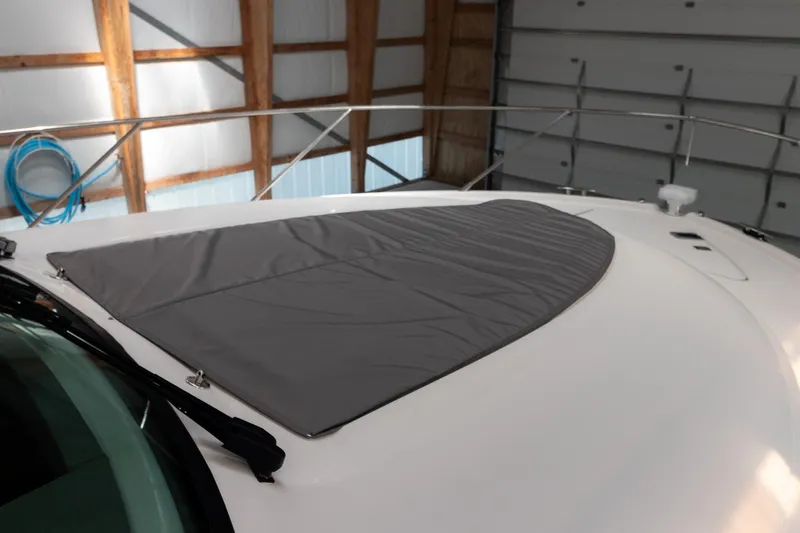 Noor Yacht Photos Pics 2023 Tiara Yachts C44 Coupe with protective cover on deck in storage.