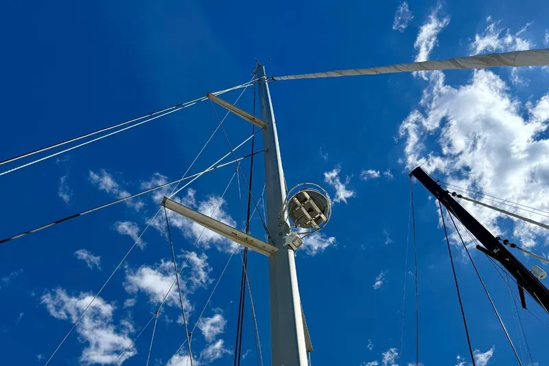  Yacht Photos Pics Mast of 2011 Lagoon LAGOON 500 sailboat against a bright blue sky.