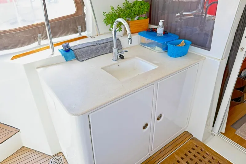  Yacht Photos Pics Outdoor sink area on 2011 Lagoon LAGOON 500 yacht with storage and accessories.