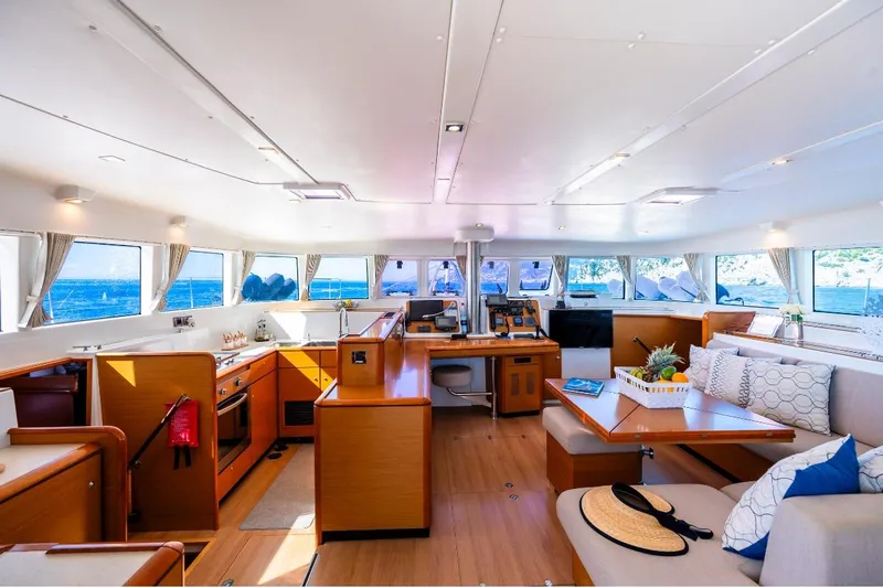  Yacht Photos Pics Luxurious interior of 2011 Lagoon 500 yacht with panoramic windows and elegant furnishings.