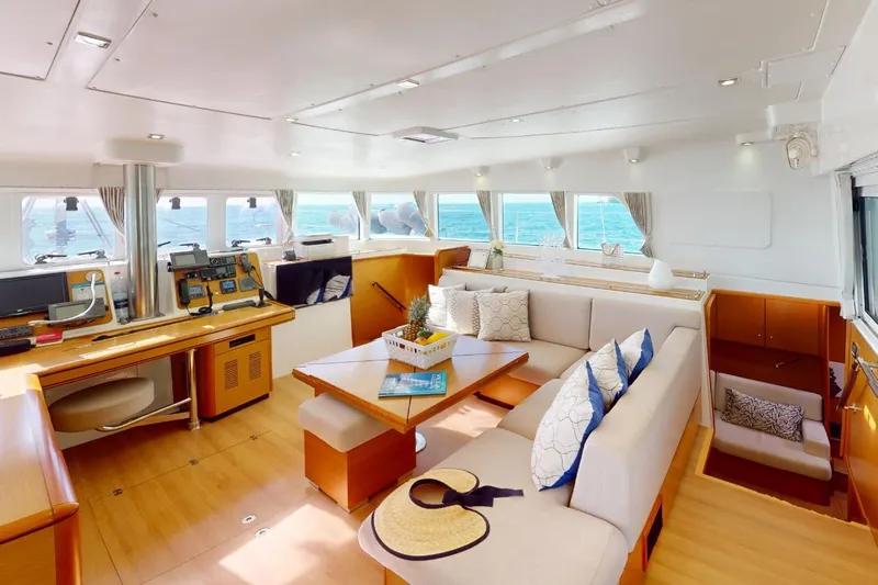  Yacht Photos Pics Luxurious interior of 2011 Lagoon LAGOON 500 catamaran with spacious seating and navigation area.