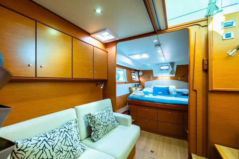  Yacht Photos Pics Luxurious interior of 2011 Lagoon 500 yacht with cozy seating and elegant bedroom.