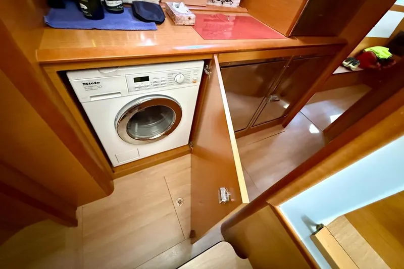  Yacht Photos Pics Laundry area inside 2011 Lagoon LAGOON 500 yacht with Miele washing machine.