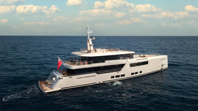 Miss Candy Yacht Photos Pics Versilcraft HS 2022 yacht cruising on open sea under clear skies.