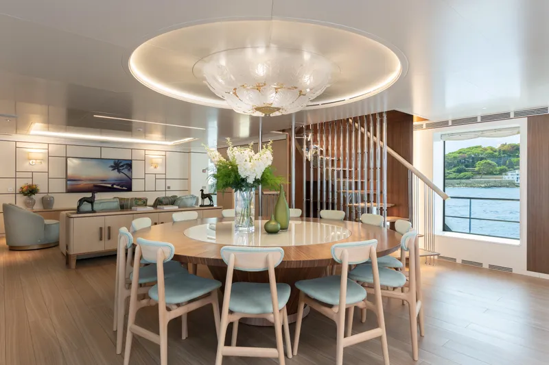 Miss Candy Yacht Photos Pics Luxurious Versilcraft HS 2022 yacht interior with elegant dining area and modern decor.