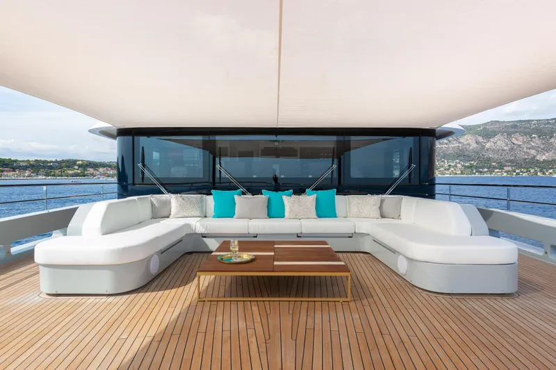 Miss Candy Yacht Photos Pics Luxurious Versilcraft HS 2022 yacht deck with elegant seating and ocean view.