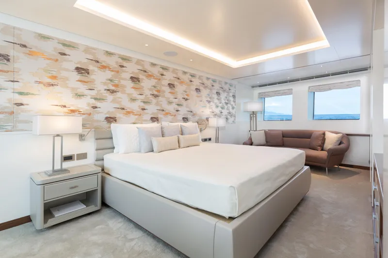 Miss Candy Yacht Photos Pics Luxurious Versilcraft HS 2022 yacht bedroom with modern decor and ocean view.