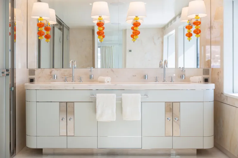 Miss Candy Yacht Photos Pics Luxurious Versilcraft HS 2022 yacht bathroom with elegant double sink vanity and modern lighting.