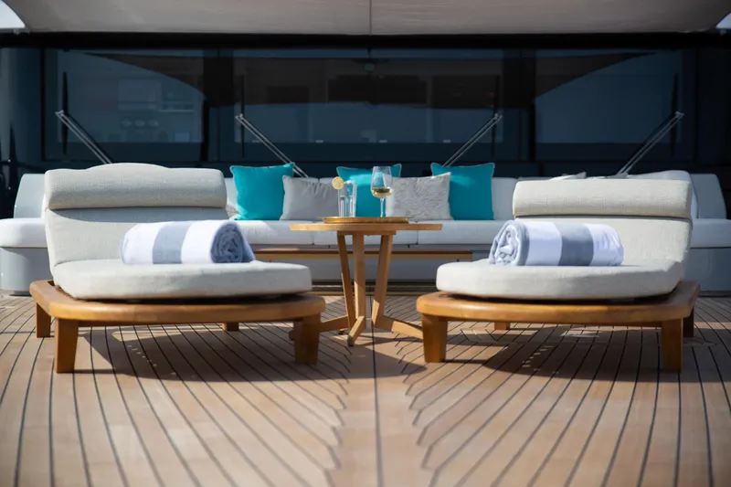 Miss Candy Yacht Photos Pics Luxury Versilcraft HS 2022 yacht deck with sun loungers and drinks table.