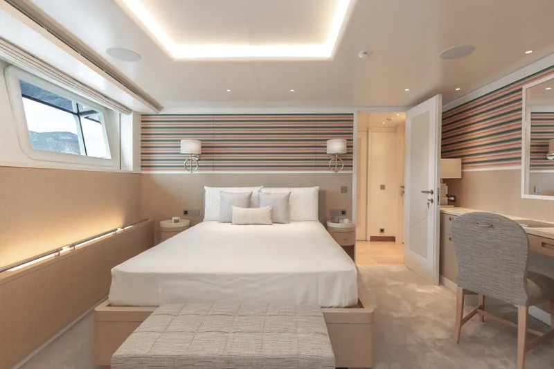 Miss Candy Yacht Photos Pics Luxurious Versilcraft HS 2022 yacht bedroom with modern decor and elegant lighting.