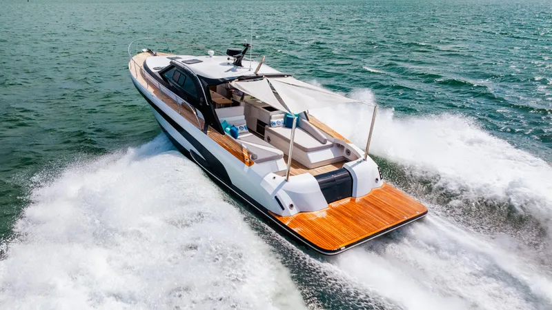 Mojo Yacht Photos Pics 2022 Anka 45 Coupe Cruiser yacht speeding on open water.