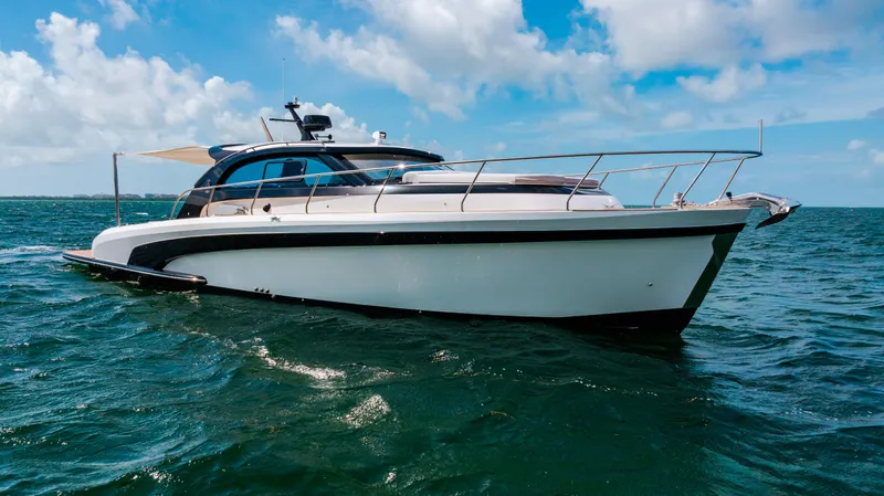 Mojo Yacht Photos Pics 2022 Anka 45 Coupe Cruiser yacht on open water under blue sky.