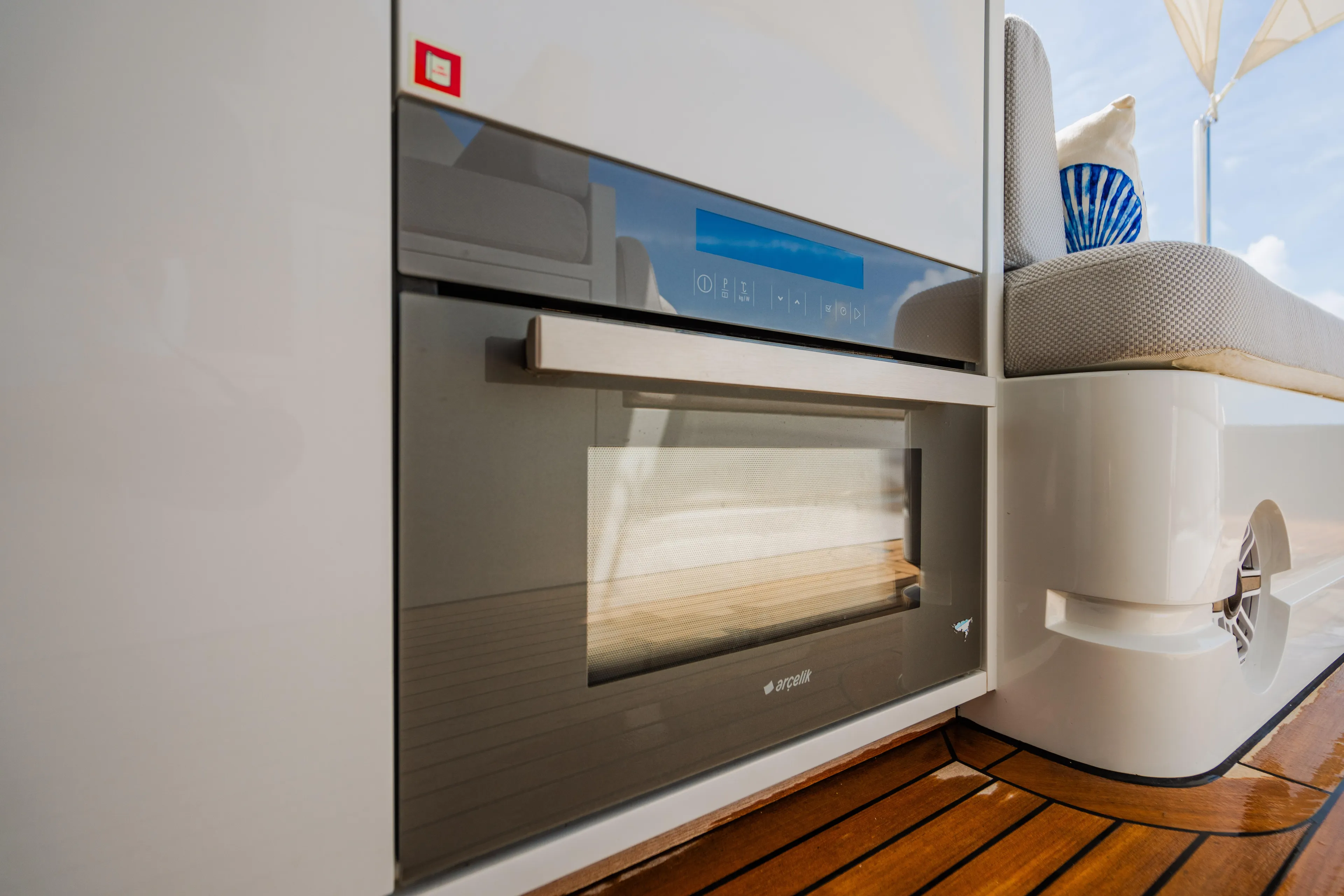 Mojo Yacht Photos Pics Modern kitchen appliance on Anka 45 Coupe Cruiser 2022 yacht with wooden flooring.