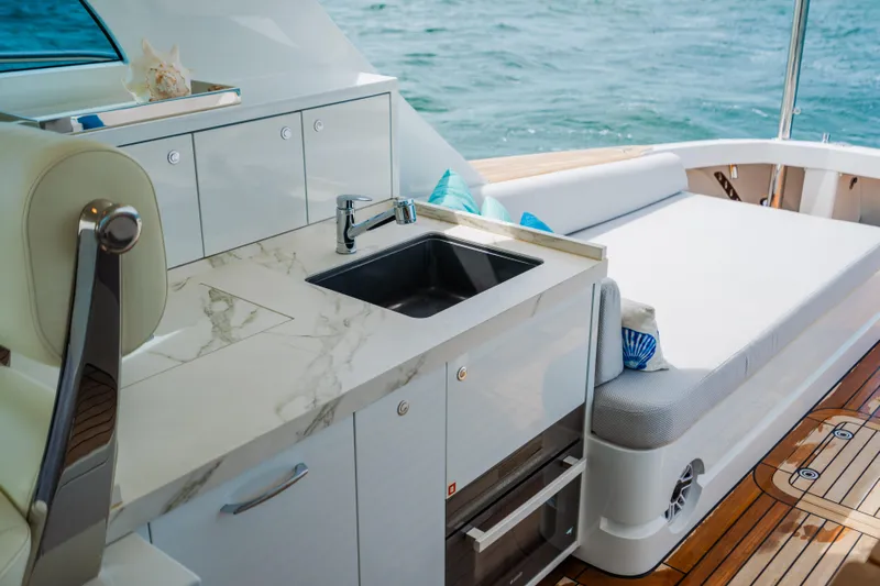 Mojo Yacht Photos Pics Luxury Anka 45 Coupe Cruiser 2022 yacht interior with sink and seating area.