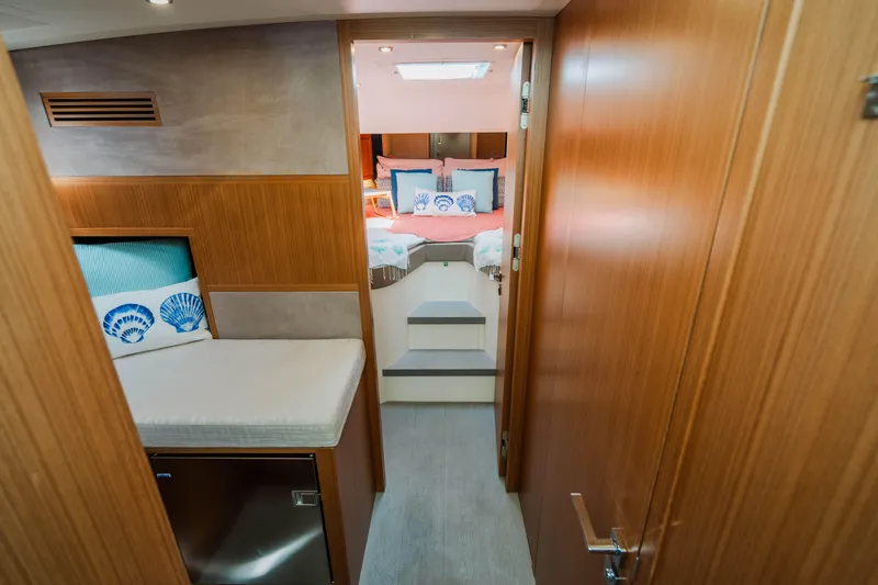 Mojo Yacht Photos Pics Interior of 2022 Anka 45 Coupe Cruiser, featuring cozy cabin and modern wooden finishes.