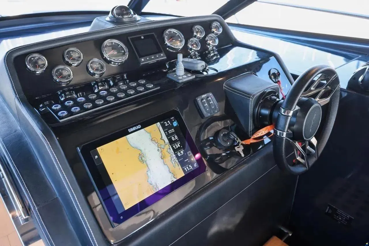 2023 Focus Power 36 boat dashboard with navigation system and steering wheel.