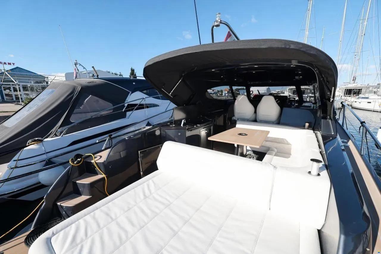 2023 Focus Power 36 yacht with luxurious seating and sleek design at a marina.