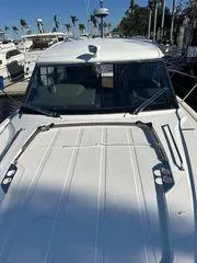 This Could Be Yours Yacht Photos Pics 2023 Bavaria R40 Coupe yacht docked at marina with clear blue sky.