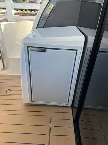 This Could Be Yours Yacht Photos Pics 2023 Bavaria R40 Coupe yacht interior with sleek cabinetry on wooden deck.