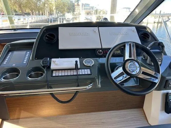 This Could Be Yours Yacht Photos Pics Helm of 2023 Bavaria R40 Coupe with modern controls and navigation equipment.