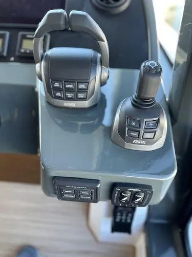 This Could Be Yours Yacht Photos Pics 2023 Bavaria R40 Coupe boat controls with joystick and throttle levers.
