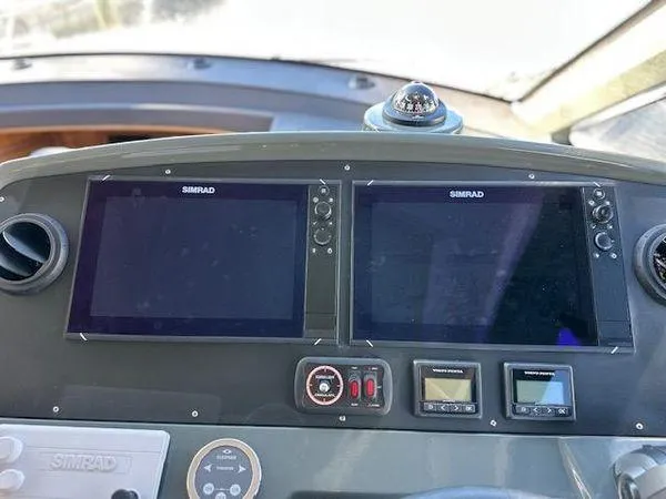 This Could Be Yours Yacht Photos Pics Control panel of 2023 Bavaria R40 Coupe with dual Simrad displays.