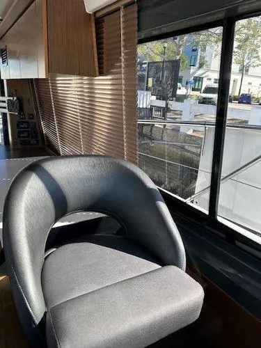 This Could Be Yours Yacht Photos Pics Luxurious interior of 2023 Bavaria R40 Coupe with modern seating and large windows.