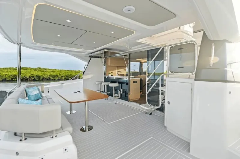  Yacht Photos Pics Luxurious 2025 Aquila 50 Yacht interior with modern seating and sleek design.