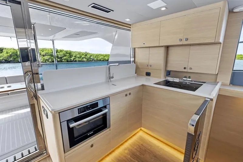  Yacht Photos Pics Modern kitchen interior on 2025 Aquila 50 Yacht with sleek cabinetry and appliances.