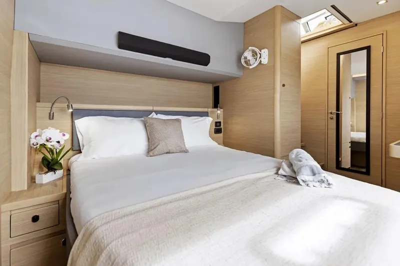  Yacht Photos Pics Luxurious bedroom interior of 2025 Aquila 50 Yacht with modern design and elegant decor.