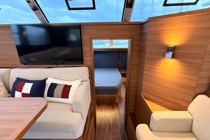  Yacht Photos Pics Luxurious interior of 2025 Aquila 50 Yacht with modern furnishings and cozy cabin.