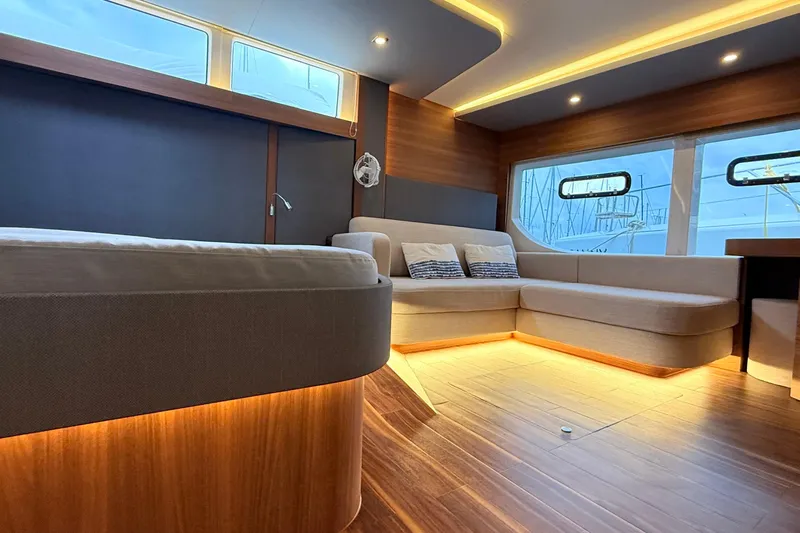  Yacht Photos Pics Luxurious interior of 2025 Aquila 50 Yacht with modern seating and ambient lighting.