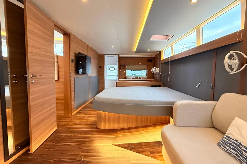  Yacht Photos Pics Luxurious interior of 2025 Aquila 50 Yacht with modern wood finishes and elegant design.