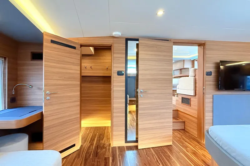  Yacht Photos Pics Luxurious interior of 2025 Aquila 50 Yacht with modern wood finish and elegant design.