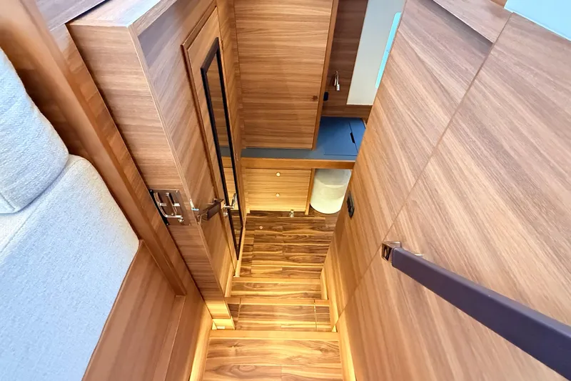  Yacht Photos Pics Interior of 2025 Aquila 50 Yacht, featuring elegant wood paneling and modern design.