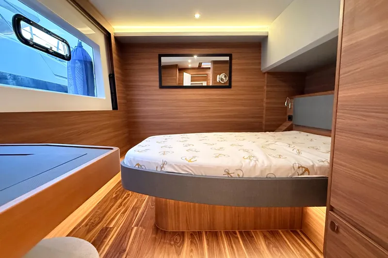  Yacht Photos Pics Luxurious cabin interior of 2025 Aquila 50 Yacht with wood finish and modern design.