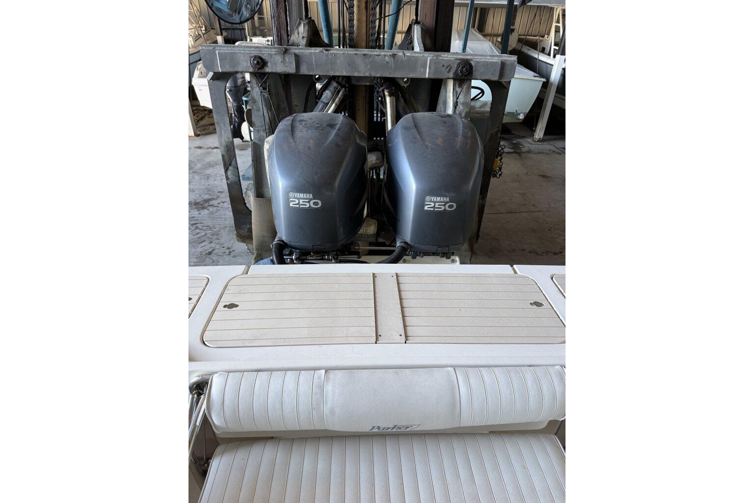 2006 Parker 2820 XL Sport Cabin with twin Yamaha 250 engines in a garage.