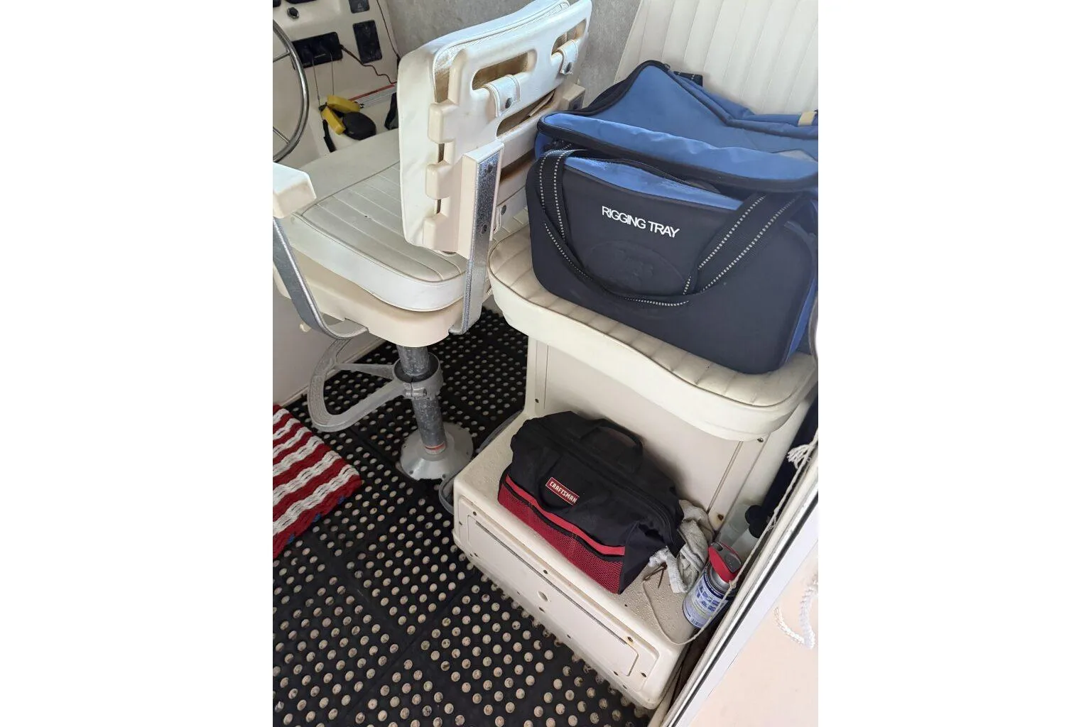 Interior of 2006 Parker 2820 XL Sport Cabin with rigging tray and storage bags.