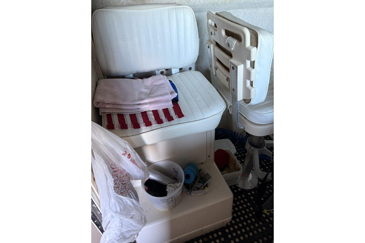 2006 Parker 2820 XL Sport Cabin interior with white seating and storage items.