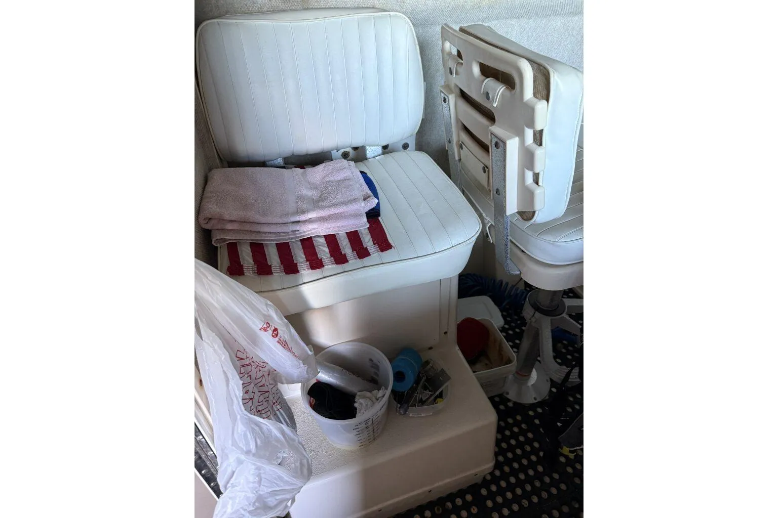 2006 Parker 2820 XL Sport Cabin interior with white seating and storage items.