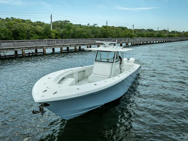  Yacht Photos Pics 2018 Yellowfin 39 Offshore boat cruising on a scenic waterway.